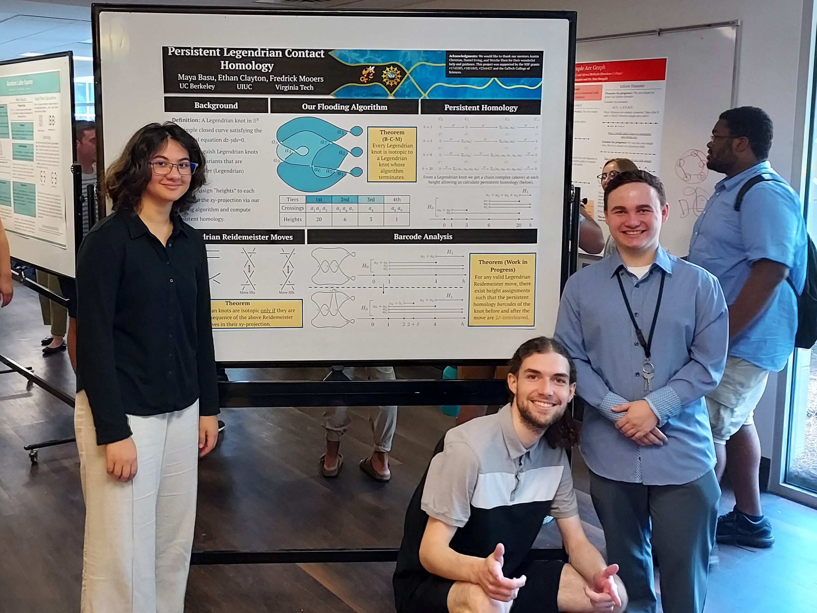 Mathematicians Maya Basu, Ethan Clayton, and Fredrick Mooers standing in front of their poster 'Persistent Legendrian Contact Homology'